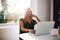 Female working on laptop in kitchen