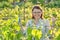 Female working with vine bushes, spring summer pruning vineyard