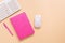 Female workspace, pink notebook, keyboard and mouse on a pastel background. Desktop, home office. Top view, flat lay, copy space