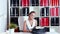 Female writer typing on an old typewriter in the office