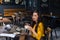 Female writer with vintage typewriter in a coffee shop