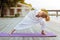 Female yogi stretching her muscles while doing exercises