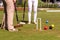 Females croquet player hitting the ball with mallet
