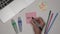 Females hand writing MUSIC on adhesive notes