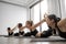 Females holding Bow Pose in sports club studio