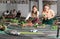 females holding remote control and playing slot car racing