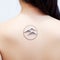 Feminine Back Tattoo With Circle Design And Mountain Elements