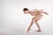 Feminine ballet dancer expressing elegance in the studio