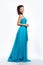 Feminine. Graceful happy woman in blue dress