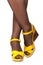 Feminine legs, yellow sandals