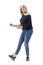 Feminine middle age modern woman dancing carefree in casual clothes wearing jeans and sneakers