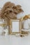 Feminine Mockup vintage gold frame with fluffy branches of dried flowers,