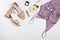 Feminine stylish summer outfit with sandals, silk top and other accessories on the white background,