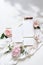 Feminine vertical wedding, birthday mock-up scene. Blank paper greeting cards, envelope, ucalyptus, pink roses, peony