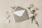 Feminine wedding, birthday stationery composition. Blank greeting card, invitation mockup with craft envelope. White