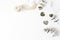 Feminine wedding desktop scene. Composition of dry silver dollar eucalyptus leaves and silk ribbons on white table