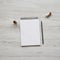 Feminine workspace with pencil, lipstick and blank notepad, top view. Flat lay, overhead, from above