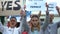 Feminist protesters chanting waving banners, protection of women rights equality