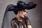 Femme fatale woman woman in lace dresss and black hat