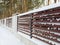 Fence covered with snow