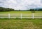 Fence in farm field with cloudy