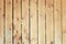 The fence of flat boards. Wooden vertical bars. Background with old wood texture.