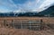 Fence Gate with Snowy Mountains