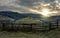 fence on hillside in late autumn gloomy sunrise