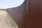 Fence made of brown metal professional flooring