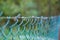 Fence made of intertwined metal mesh at low depth of field