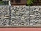 Fence made of stone in a metal mesh. Welded galvanized gabion