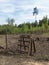 Fence made of wire and rustic ladder made of wooden logs