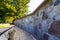 . The fence of the new Jewish cemetery in Krakow on Miodowa Street, made of tombstone fragments broken during World War II