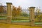 Fence and orchard in autumn landscape