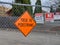 Fence outside a construction site warning pedestrians and trespassers of traffic