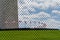 Fence outside the Washington Monument, under construction. Focus on fence, flags and monument blurred