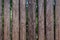 Fence from pine logs without bark