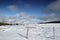 Fence in snowy landscape in Pyrenees