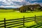 Fence and view of a farm in rural York County, Pennsylvania.