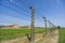 Fence and watchtower surrounding barracks in Auschwitz-Birkenau concentration camp, Poland