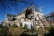 Fenced off ruins of partially destroyed historic Christchurch Cathedral supported by steel frame seismic bracing in New Zealand