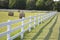 Fenced pastures and rolled hay bales