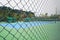 Fenced tennis court