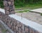 Fencing. Building Granite Fence with Design Decorative Cracked Wild Stone