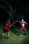 Fencing Duel Between Two Knights in Armor in the Forest