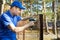 Fencing services - worker installing welded metal mesh fence