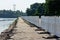 Fencing of the sidewalk repair work on the river embankment