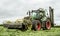 Fendt green tractor with claas mowers in silage field