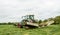 Fendt green tractor with claas mowers in silage field