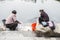 FengHuang, China Feb 21, 2014 : two asian women are washing clothes at the river by using hand as a traditional washing